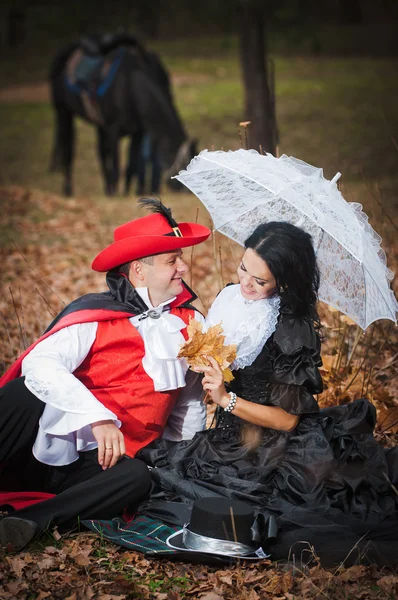 Man and woman in costume — Stock Photo, Image