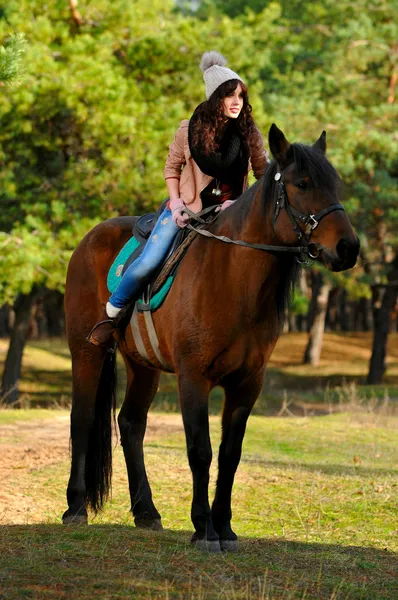 Woman on horse — Zdjęcie stockowe