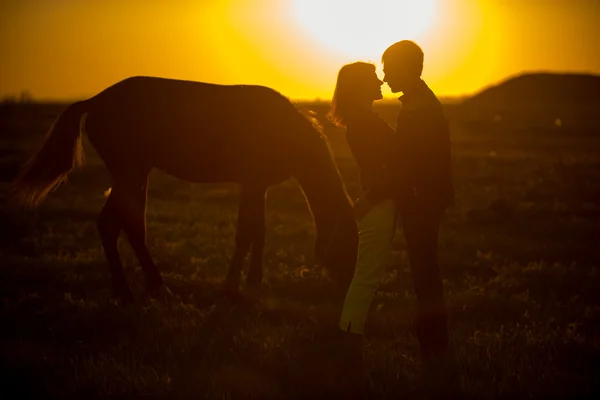 Man and woman in horse — Stock Photo, Image