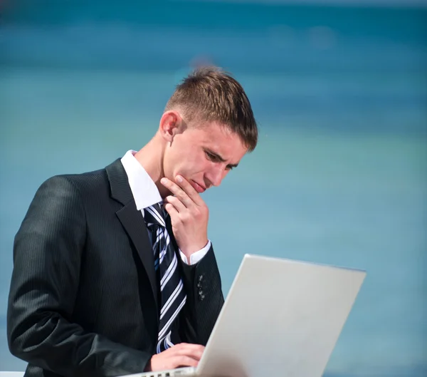 Businessman at the beach — Stock Photo, Image