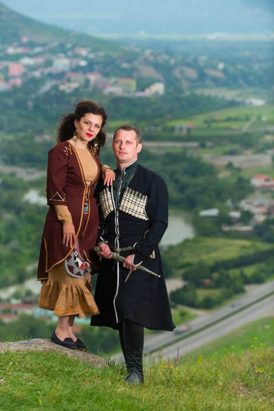 Man and woman in Georgian national dress. — Stock Photo, Image