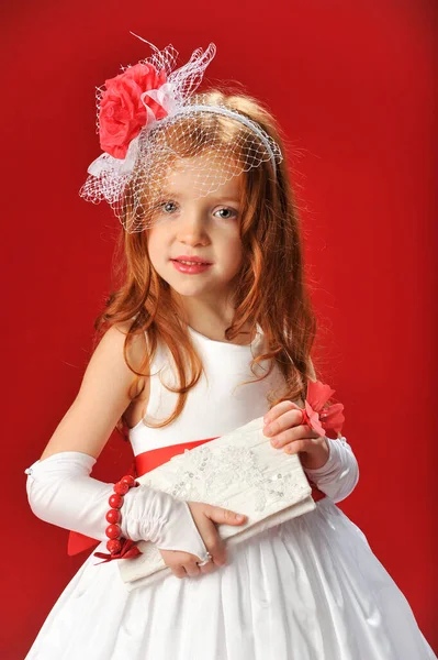 Little Girl White Dress Red Flower Petals Red Background — 图库照片