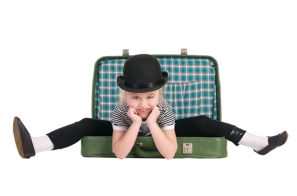 Child sitting in an old green suitcase in anticipation of travel — Stock Photo, Image