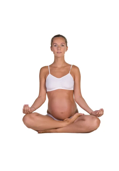 Mujer embarazada en yoga posando —  Fotos de Stock