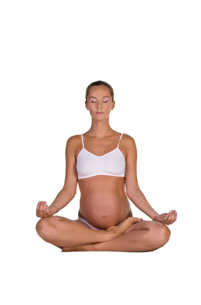 Mulher grávida em ioga posando — Fotografia de Stock