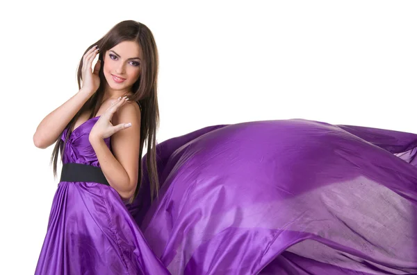 Girl in flying purple dress — Stock Photo, Image