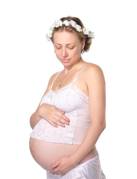 Беременная девушка в ярких цветах — стоковое фото