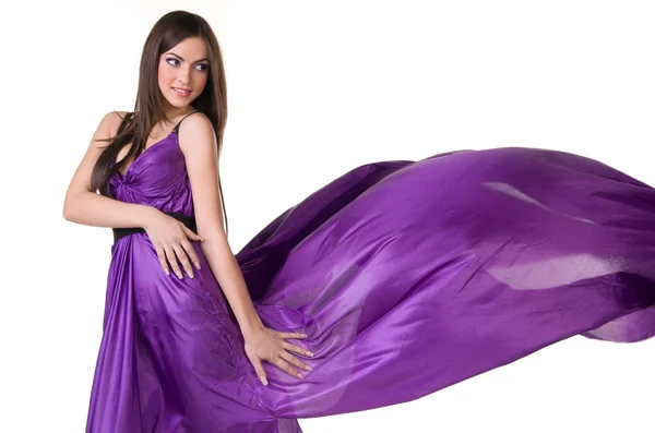 Girl in flying purple dress — Stock Photo, Image