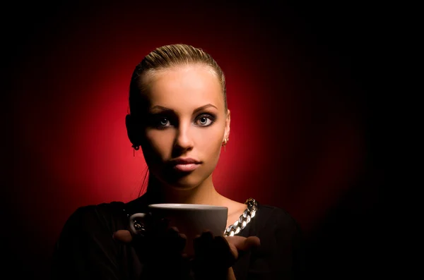 Sexy girl with aggressive makeup and white cup — Stock Photo, Image