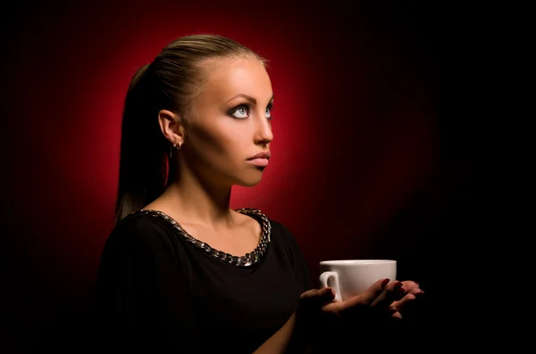 Sexy girl with aggressive makeup and white cup — Stock Photo, Image