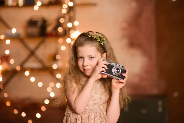 Little Girl Festive Dress Flowing Hair Holds Vintage Camera Her — Stock Photo, Image