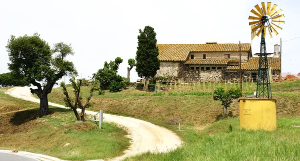 Panoramic of a farmhouse with windmill — Stock Photo, Image