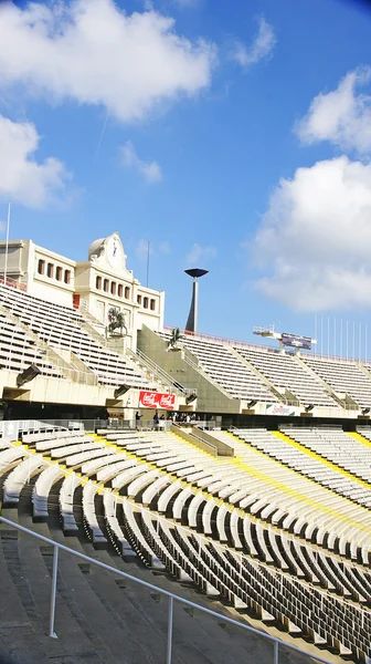 Harrow seats under the arch and the clock in Montjuïc's olympic stadium, Barcelona — Zdjęcie stockowe