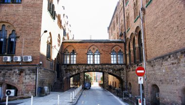 Alley with bridged from complex hospital Sant Pau clipart