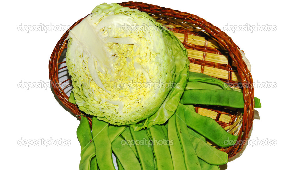 Basket of cabbage with green beans on white background