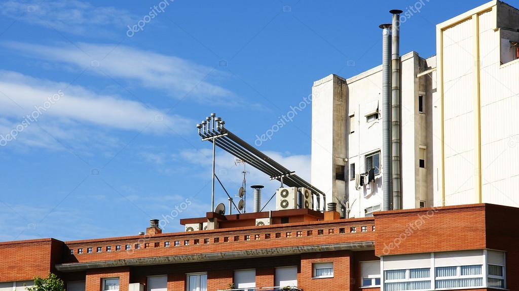 Chimneys on the roofs of some buildings
