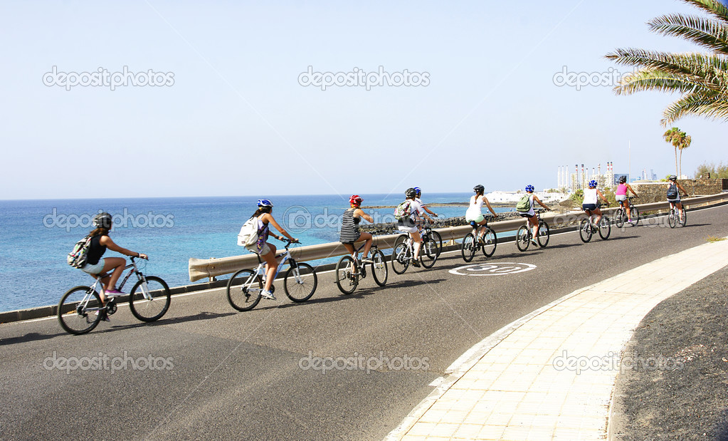 Row of cyclists in Costa Teguise