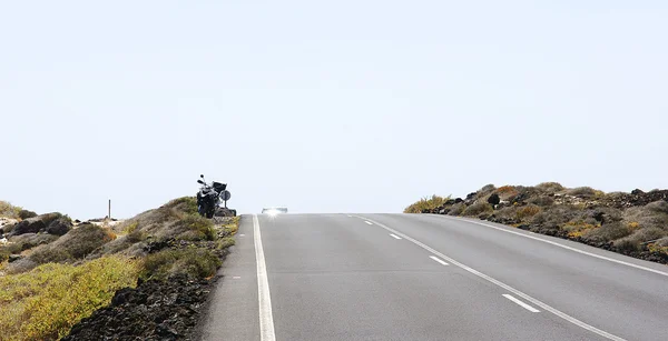 Motorcycle in the landscape of Punta Mujeres — Stock Photo, Image