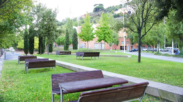 Tables and benches in Meridiana City — Stock Photo, Image