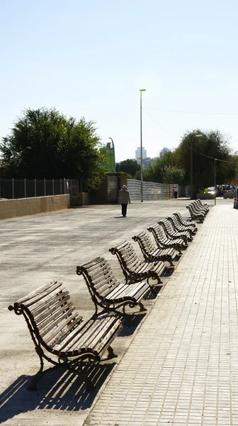 Row of empty benches — Stock Photo, Image