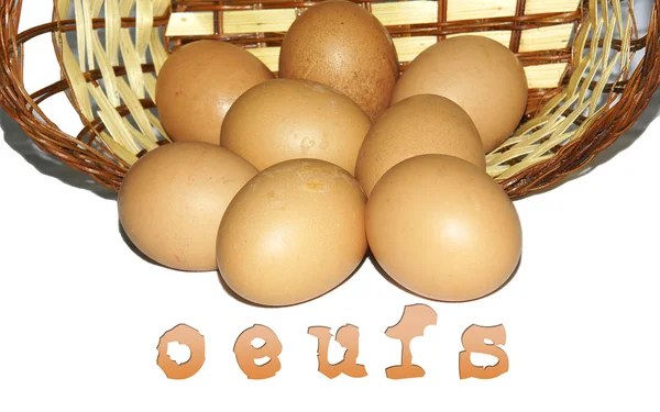 Wicker basket with chicken eggs — Stock Photo, Image