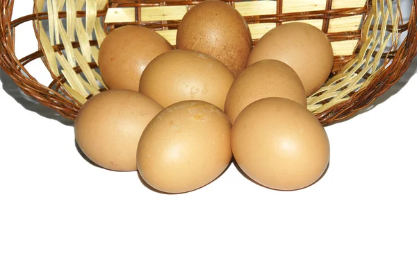 Wicker basket with chicken eggs — Stock Photo, Image