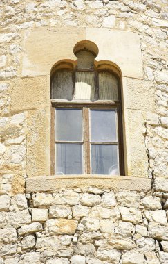 Window in the tower of the complex of warehouses in El Garraf Güell, Barcelona