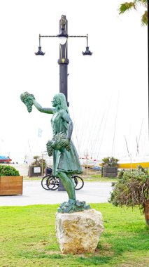 Heykel, Barselona, Katalunya, İspanya ve Avrupa 'daki bir Sitges bahçesindeki üzüm hasadına adanmıştır.