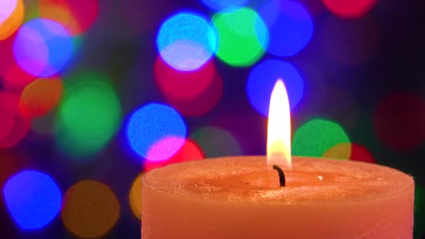 Decorative Candle Burns Background Festive Flashing Lights — Stock Video