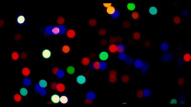 Siyah ekranda rengarenk parlayan ışıklar