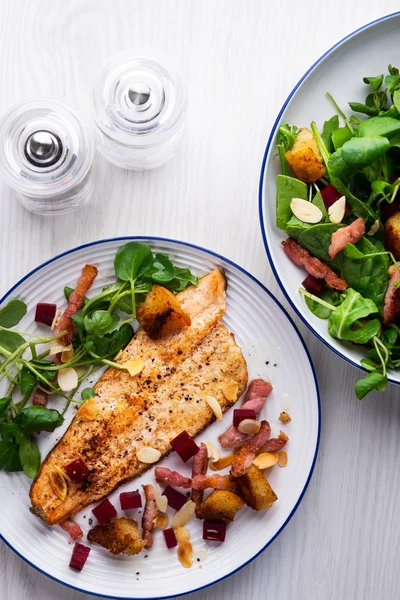 Pan-fried trout with bacon and beetroot Stock Picture