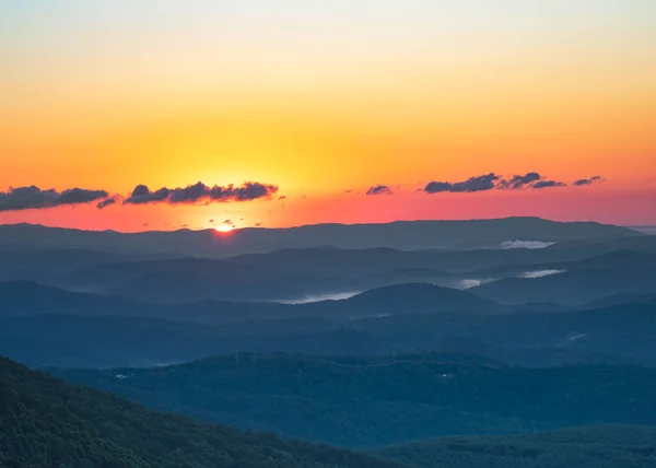 Day begins in the Blue Ridge Mountains of western North Carolina.