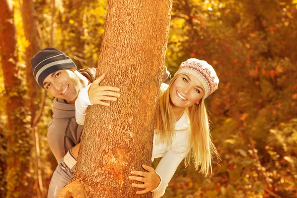 Young family in the wood — Stock Photo, Image