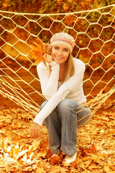 Woman sitting in hammock — Stock Photo, Image