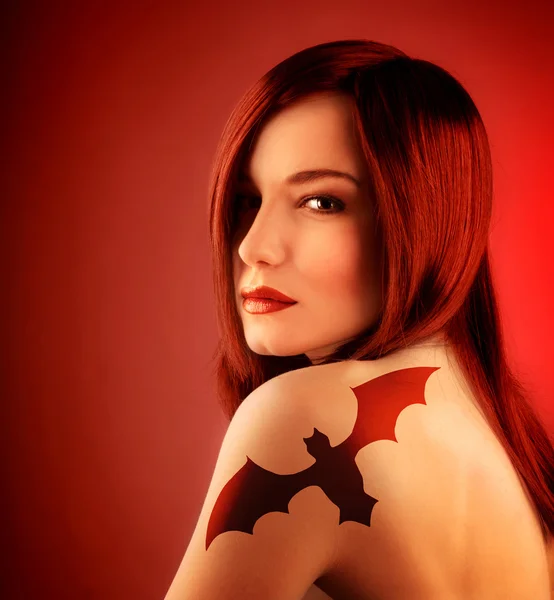 Girl with bat tatoo — Stock Photo, Image