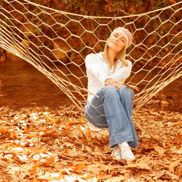 Cute female in sitting in hammock — Stock Photo, Image