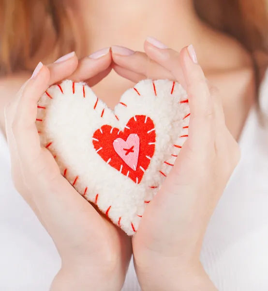 Heart toy in hands — Stock Photo, Image