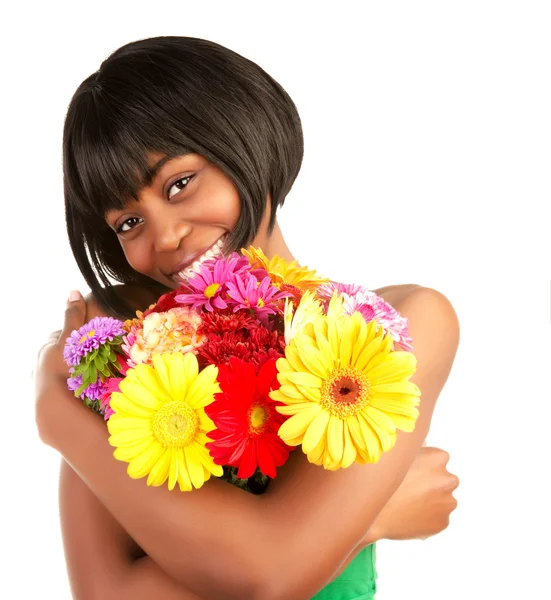 Mulher negra com flores de gerbera — Fotografia de Stock