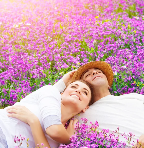 Happy lovers on lavender glade — Stock Photo, Image