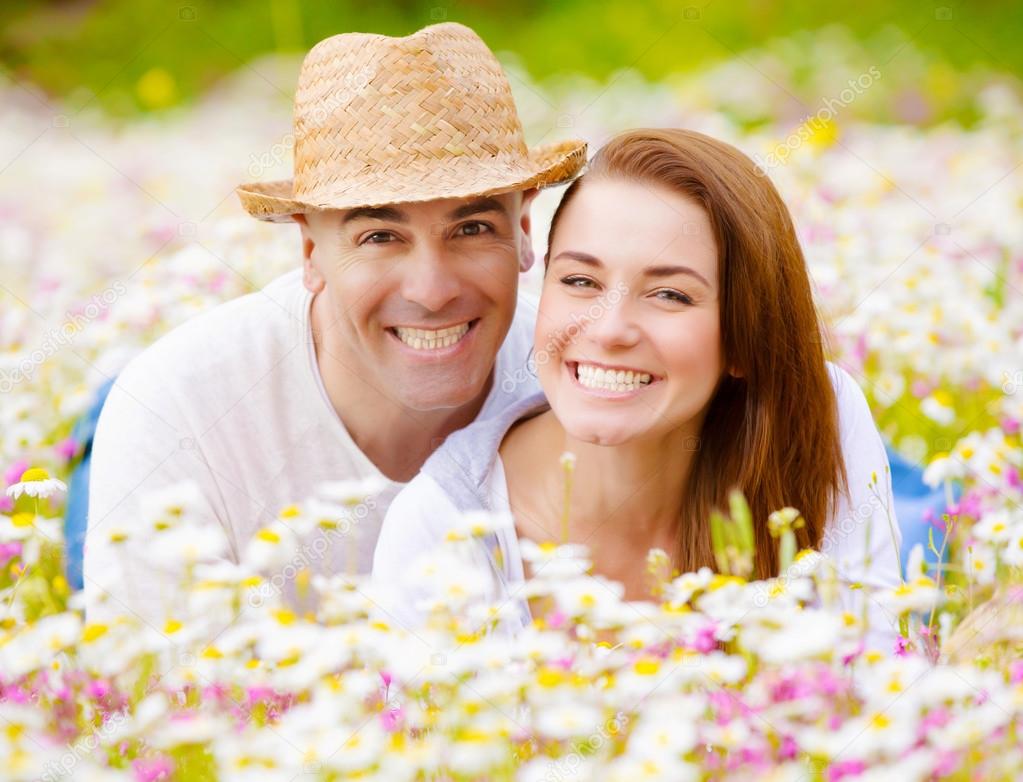 Young family on floral field