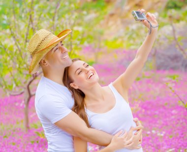 Cute couple photographing of themself