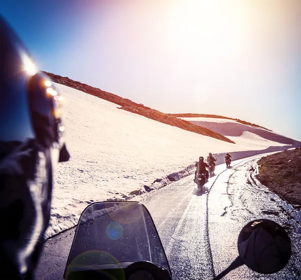 Group of bikers on snowy road — Stock Photo, Image