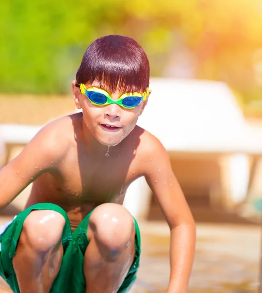 Sporty boy jumping into the pool — Stock Photo, Image