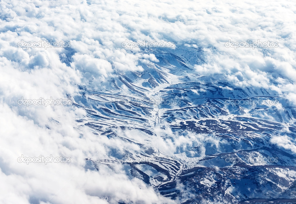 Bird's eye view on snowy mountains