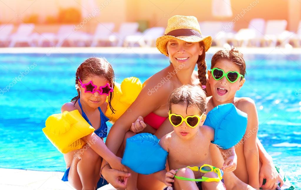 Happy family at the pool