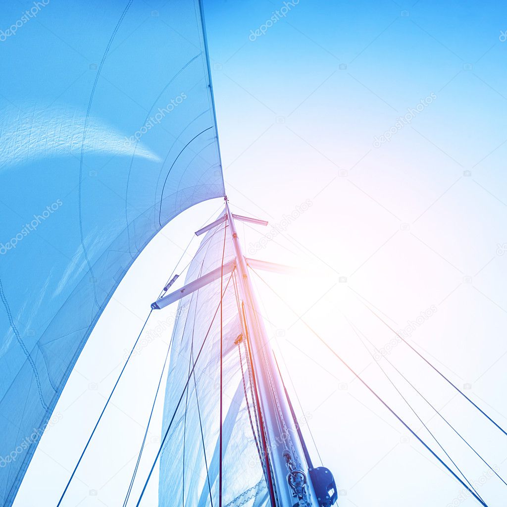 Sail on blue sky backdrop