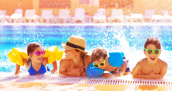Happy family in the pool