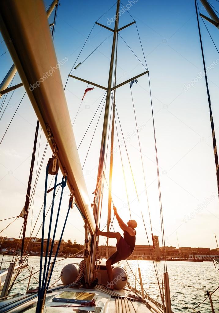 Young sailor on sailboat