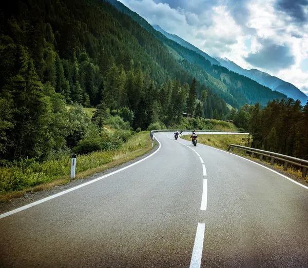 Group of bikers on mountainous road — Stock Photo, Image