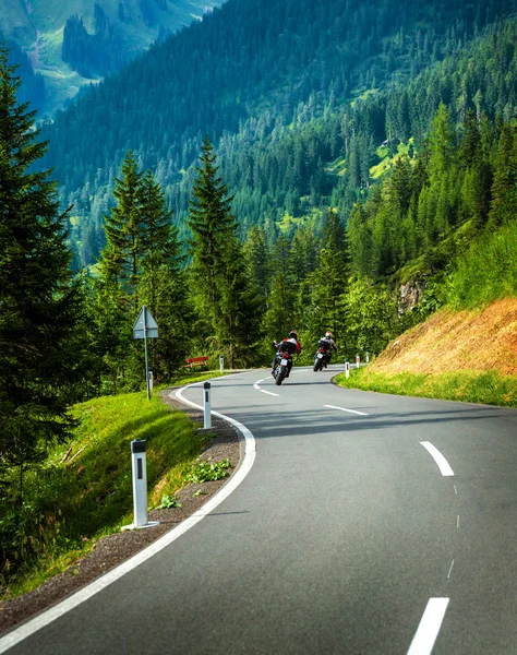 Group of motorcyclists in Alpine mountains — Stock Photo, Image